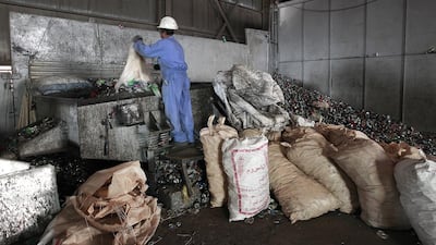 Soft-drink cans being recycled at one of the Lucky Group’s UAE facilities. Jeffrey E Biteng / The National