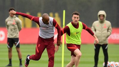 Liverpool's Diogo Jota and Fabinho during training.