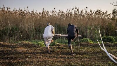 South African Muslims perform ritual ablutions as they gather for the early morning Eid Al Adha prayer at the Rose Park in Lenasia, 30 kilometres south of Johannesburg. Marco Longari / AFP