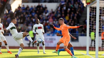 Portugal's Cristiano Ronaldo, left, scores his side's only goal in a 1-0 win over Iceland. AP Photo