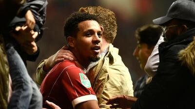 Korey Smith is hugged by fans after winning the League Cup quarter final. Neil Munns / EPA