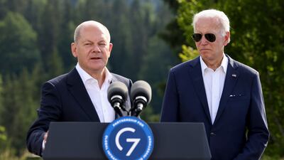 Russia's invasion of Ukraine dominated 2022 for Olaf Scholz (L) and Joe Biden. AP