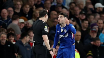 Chelsea's Pedro Neto argues with referee Darren England after being shown a red card. Reuters