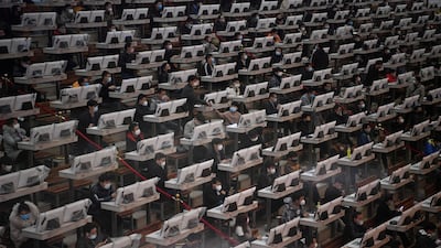 Traders wearing face masks aon the floor at a flower auction centre in Kunming, Yunnan province, China. Reuters