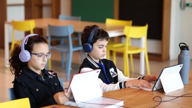 Pupils will move from distance learning back to school. Chris Whiteoak / The National