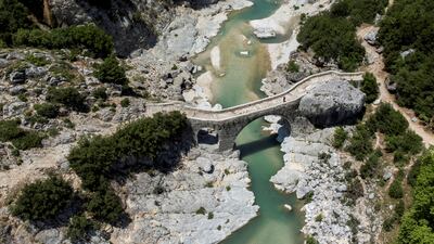 A bridge over the Shushica, a tributary of the Vjosa river in Brataj, Albania June 12, 2022. Reuters