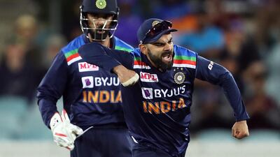 Virat Kohli of India celebrates the run out of Alex Carey of Australia. Getty