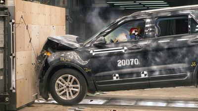 A 2014 Ford Explorer collides with a barrier at 30mph during a crash test demonstration at the Dearborn Development Center. Rena Laverty / EPA