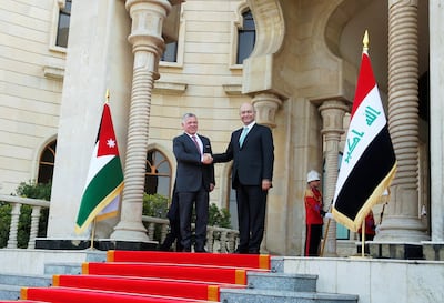 Jordan's King Abdullah shakes hands with Iraq's President Barham Saleh, during his visit in Baghdad, Iraq January 14, 2019. REUTERS/Khalid Al-Mousily