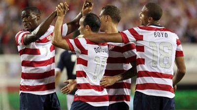 US players celebrates after scoring against Scotland