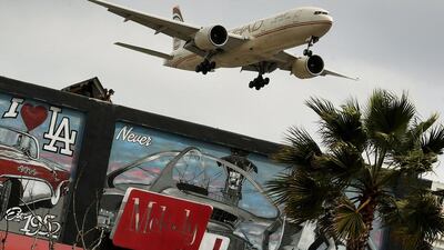 Above, an Etihad Airways aircrafts prepares to land at Los Angeles International Airport in Los Angeles, California. Mark Ralston / AFP