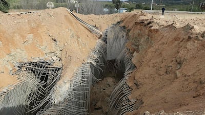 The crater from an Israeli air strike on the Qasmiyeh Bridge, on a main motorway linking the southern Tyre area to the rest of Lebanon. AFP