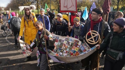 Environmental protesters in Glasgow before Cop26. The coming days will determine whether the Scottish city will host a climate change breakthrough. PA
