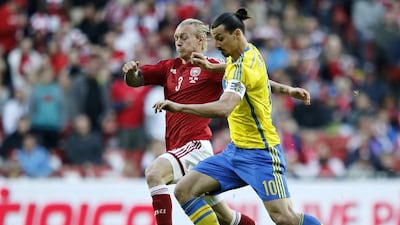 Denmark’s Simon Kjar, left, and Sweden’s Zlatan Ibrahimovic will collide again during Saturday night’s Euro 2016 qualifier in Solna. Jens Dresling / AP Photo