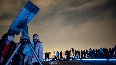 Stargazers on the observation deck at Roppongi Hills in Tokyo on November 19, 2021 to watch the lunar eclipse. AFP