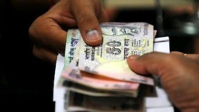 The rupee reached more than 52.70 yesterday against the dollar. Indranil Mukherjee / AFP