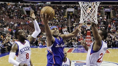 Jared Dudley attempts a layup for the Clippers on Monday night. Matt Slocum / AP
