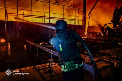 A firefighter at a blaze in Kharkiv, Ukraine after a Russian drone strike. Reuters