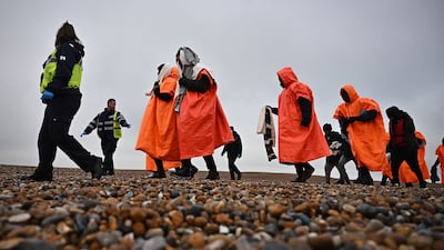 Migrants who were picked up in the English Channel by a Royal National Lifeboat Institution are taken to Dungeness, Kent, in south-eastern England. AFP