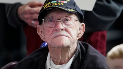 Second World War veteran Gordon Wilson, 99, celebrates Mr Eskenazi. Mr Wilson served in the Pacific aboard the USS Lexington and received a Purple Heart
