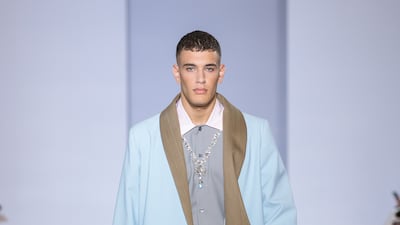 The collection's restrained use of colour is evident in this menswear look.