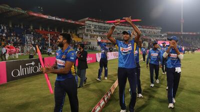 Sri Lanka players acknowledge the crowd at the Gaddafi Stadium in Lahore. EPA