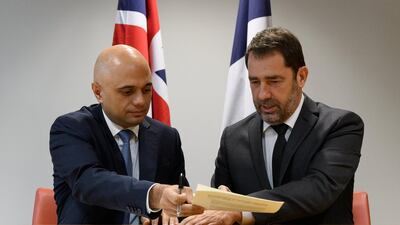 Britain's home secretary Sajid Javid and French interior minister Christophe Castaner sign a new action plan to strengthen efforts against migrant activity. Reuters.