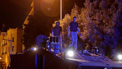 Lebanese anti-riot police stand guard atop an armoured vehicle during anti-government protests in central Beirut. AFP