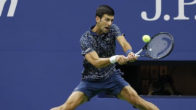 Novak Djokovic of Serbia hits a return to Juan Martin del Potro of Argentina. EPA