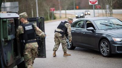 The Rhode Island National Guard have set up a checkpoint near the state border with Connecticut, with New Yorkers required to pull over and provide contact information. AP