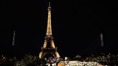 Bella Hadid models a creation by Saint Laurent in front of the Eiffel Tower at Paris Fashion Week. AFP