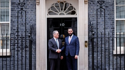 Keir Starmer, UK Prime Minister, left, greets Syrian President Ahmad Al Shara at No 10 Downing Street on his arrival in London. EPA