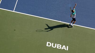 Russian Mikhail Youzhny serves to Tunisian Malek Jaziri during their ATP tennis match on the first round of the Dubai Duty Free Tennis Championships on February 22, 2016. AFP / KARIM SAHIB