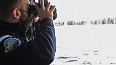 A French Maritime Gendarme searches for migrants trying to cross the Channel. AFP