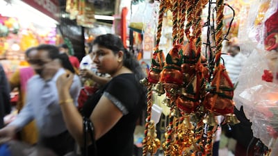 Shoppers gather to buy decorations items for Diwali near the Shiva Hindu temple in Bur Dubai. Pawan Singh / The National