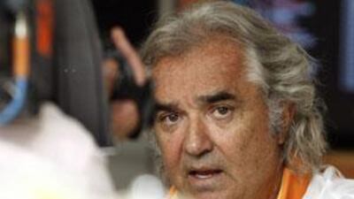 The Renaul team principal Flavio Briatore talks to reporters at the Italian Grand Prix in Monza yesterday.