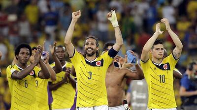 Colombia's Jame Rodriguez, right, Mario Yepes, centre, and Carlos Sanchez Moreno, left, acknowledge the crowd after beating Uruguay 2-0 on Saturday night at the 2014 World Cup in Rio de Janeiro, Brazil. Antonio Calanni / AP