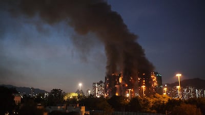 Thick smoke and flames rise from the residential estate. AFP