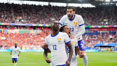 France's Randal Kolo Muani, left, celebrates with teammates after his shot was deflected in off Jan Vertonghen to give them a 1-0 Euro 2024 last-16 victory against Belgium at the Dusseldorf Arena on Monday July 1, 2024. PA