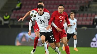 Germany's midfielder Kai Havertz battles for the ball with Turkey defender Ozan Kabak. AFP