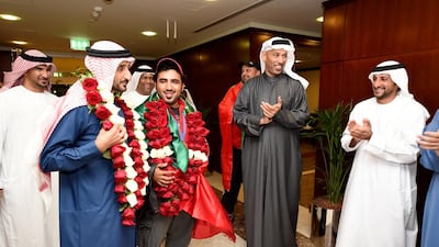 Khaled Al Kaabi, in baseball cap, and Sheikh Ahmed bin Hasher Al Maktoum, to his left. Photo Courtesy / Mustafa Alamiri of UAENOC