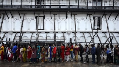 Nepali Hindu devotees queue to worship the Hindu goddess Teleju Bhawani during the ninth day of The Hindu Dashain Festival in Kathmandu. Dashain is the longest and the most auspicious festival in the Nepalese calendar and celebrates the triumph of good over evil. Prakash Mathema / AFP