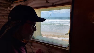 Mr Barzaq enjoys the ocean view. Photo: Mohammed Abu Amra