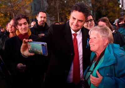 Opposition leader Peter Marki-Zay poses for a picture with a supporter at an anti-Orban rally in Budapest. Reuters