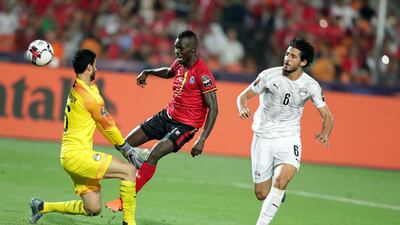 Egypt's Ahmed Hegazi, right, and goalkeeper Mohamed El Shenawy in action against Uganda's Emmanuel Arnold Okwi. EPA