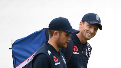 England batsman Jos Buttler, right, smiles as Liam Dawson looks on during England nets ahead of the opening match. Stu Forster / Getty Images