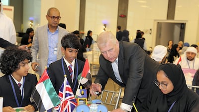 Prince Andrew, Duke of York, talks to the students of Brighton College Abu Dhabi during his visit to “The Make it Challenge” an initiative to design, create , cost and market an unmanned rescue vehicle held at the Khalifa University in Abu Dhabi. Pawan Singh / The National
