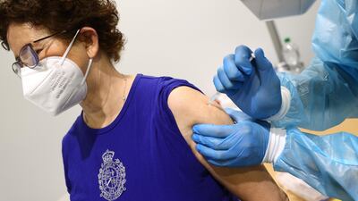 A woman receives AstraZeneca’s Covid-19 vaccine in Hagen, Germany. Reuters