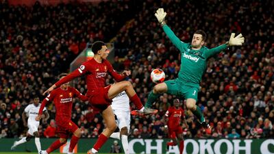 Liverpool's Trent Alexander-Arnold in action with West Ham United's Lukasz Fabianski before Sadio Mane scores. Reuters
