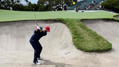 US player Dustin Johnson hits out of a bunker. AFP